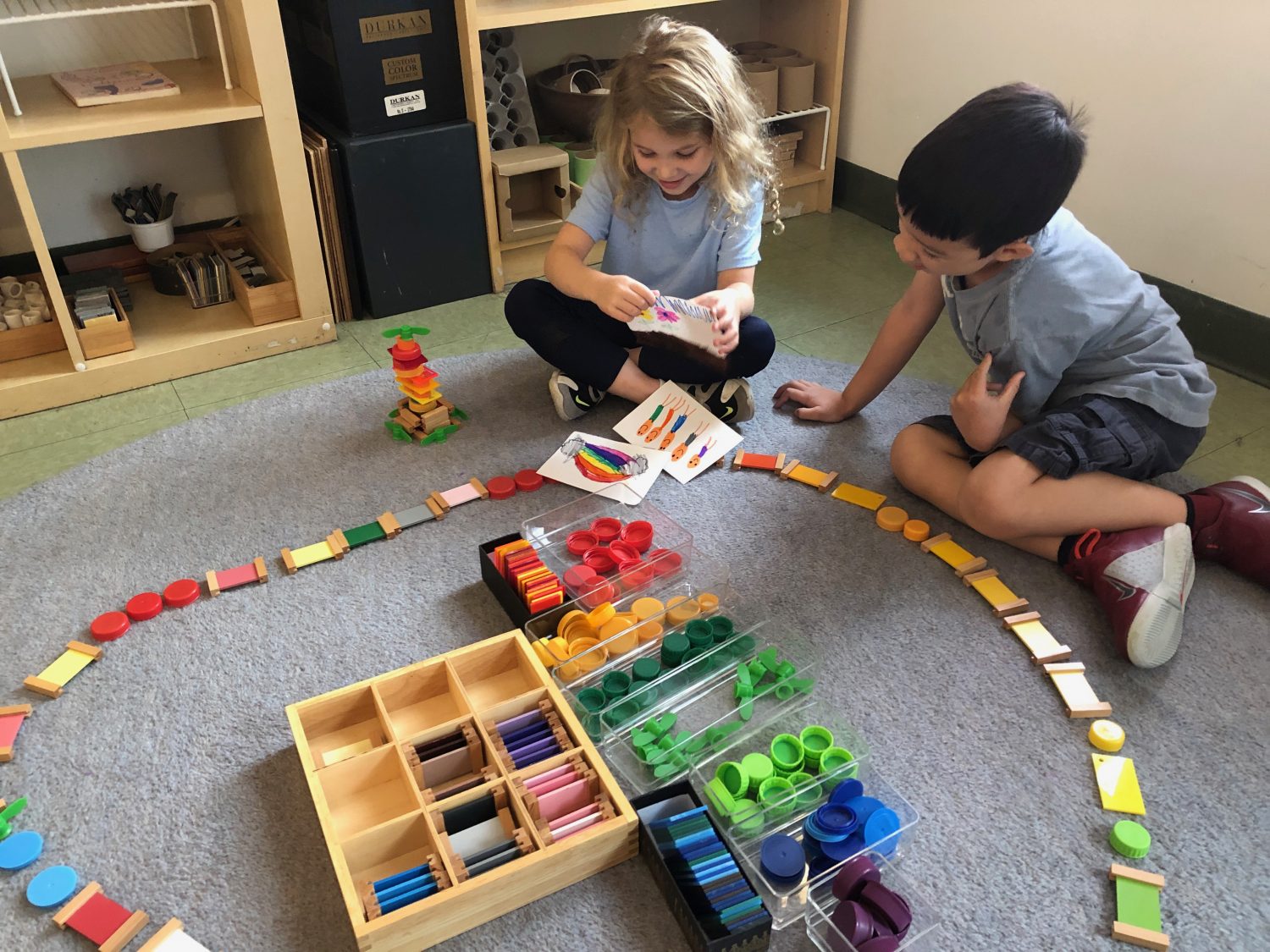 children lining up colored wood blocks