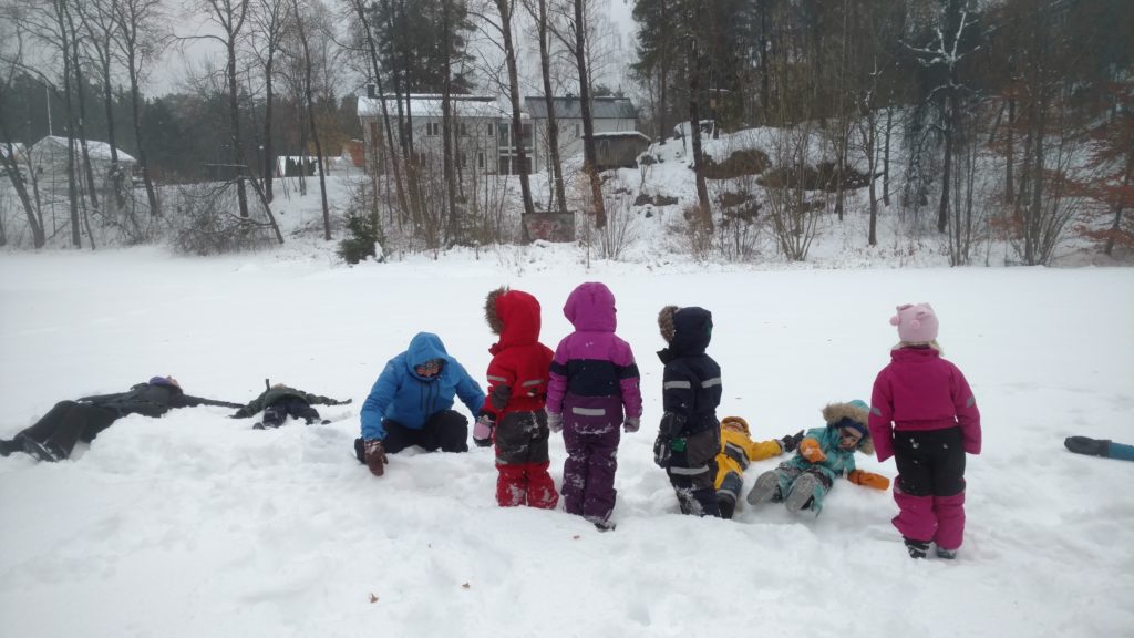 children playing in the snow