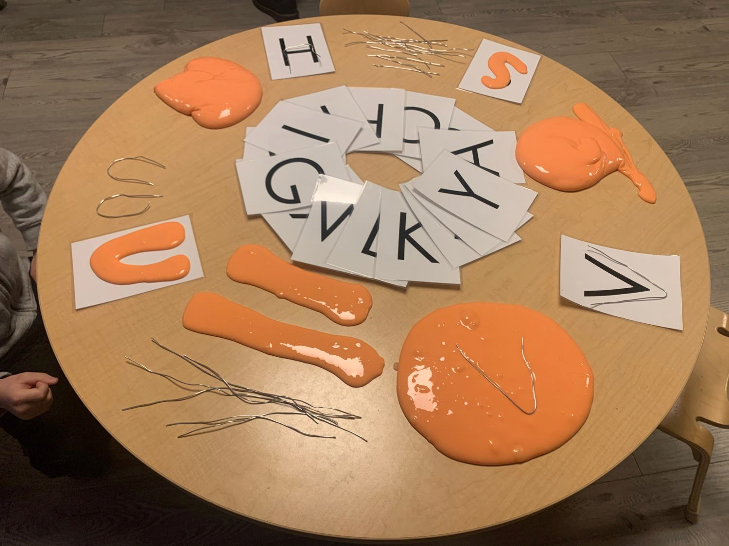 gak on table with letters